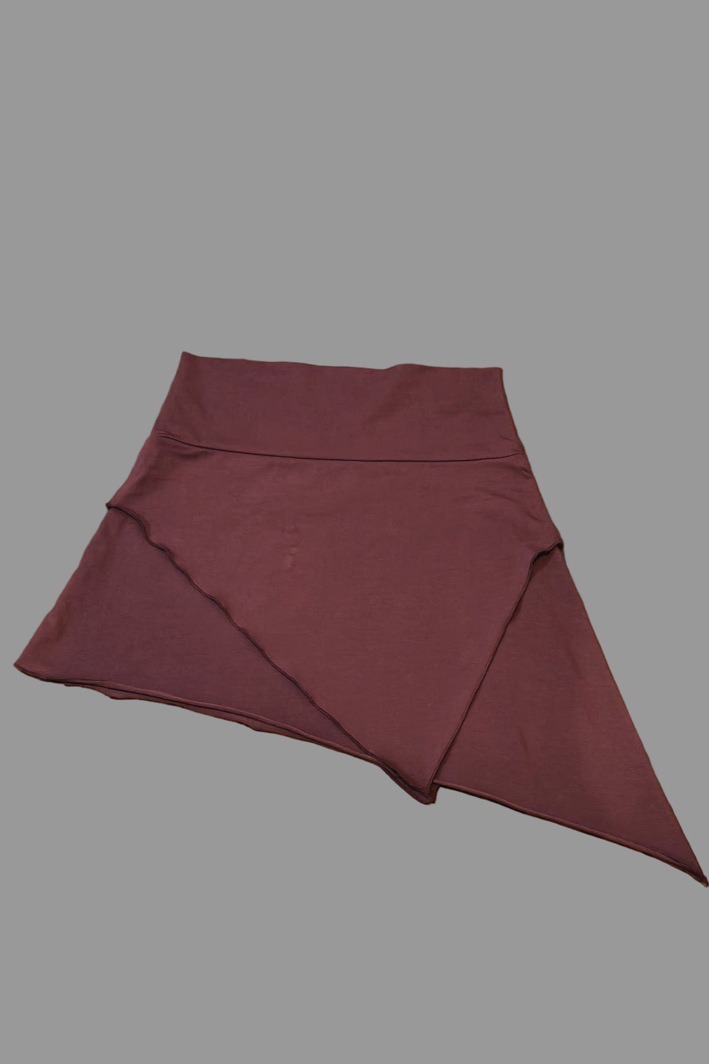 Garnet Nomad Skirt with assymetrical hem. Stretchy mini skirt.