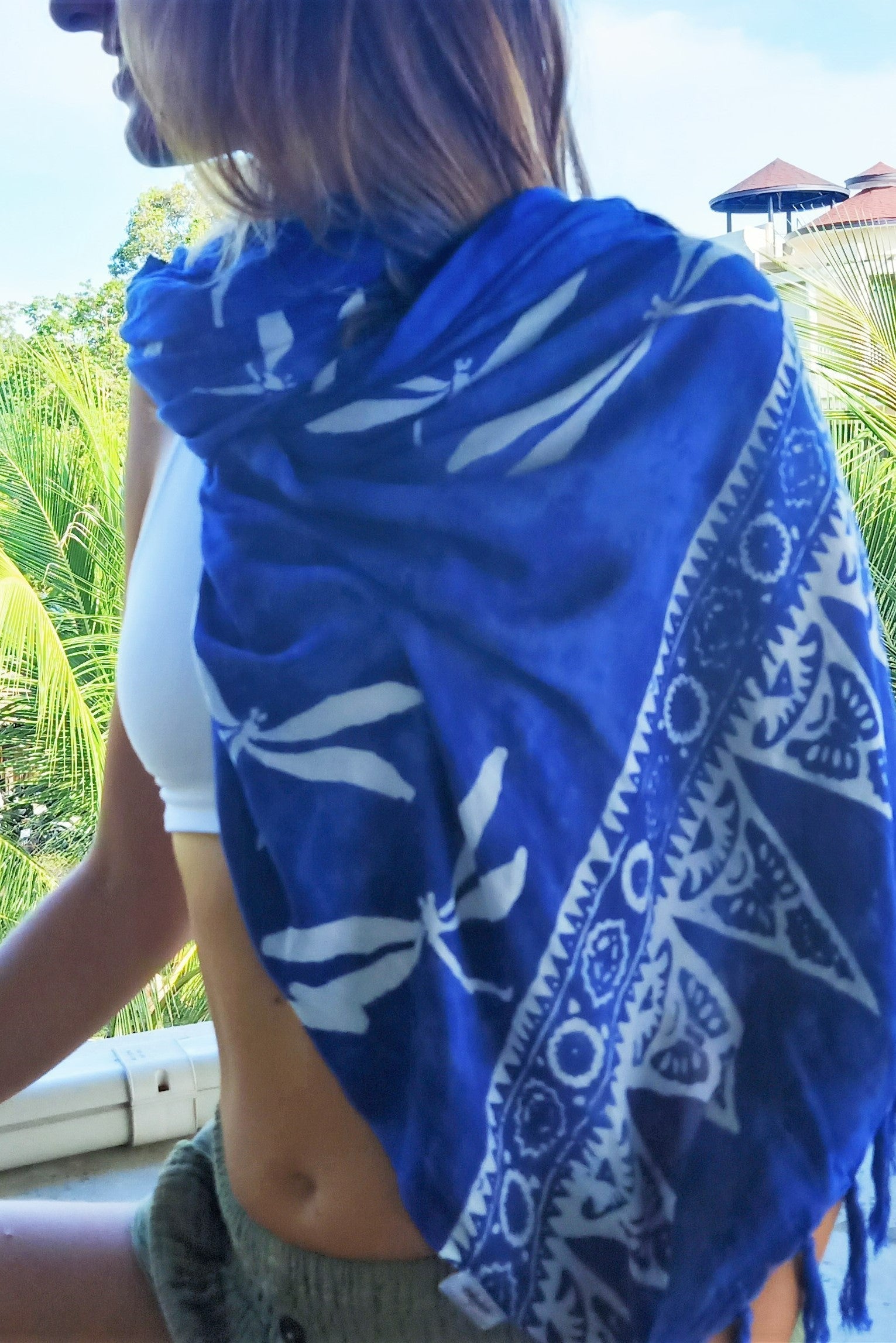 Blue rayon sarong with white dragonfly pattern. Ethically hand made with traditional batik process.