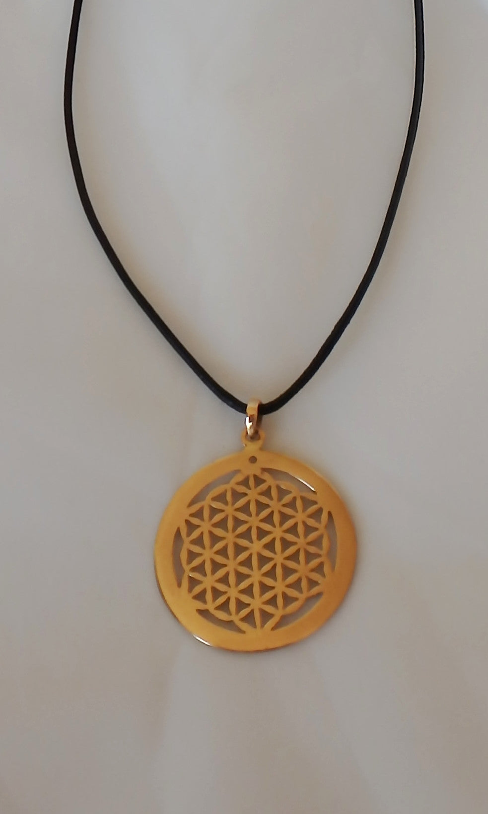 Brass Flower of Life Sacred Geometry pendent 3.5 cm (almost 1.5") in diameter, comes on black waxed cotton cord (vegan friendly).