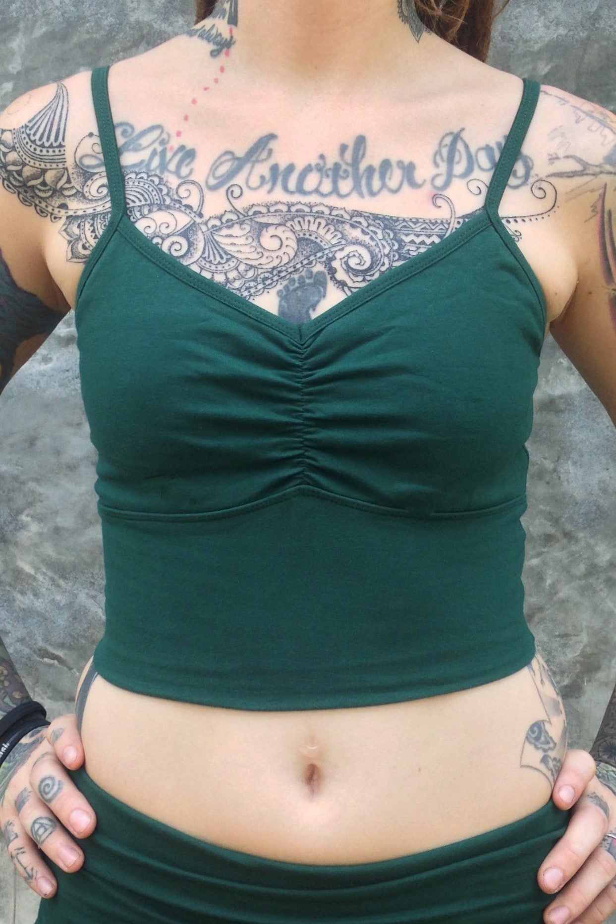 Front view of Organic Blissed Out Crop Tank in Forest green with adjustable spaghetti straps and scrunched center puckering between the breasts by Lotus Tribe Clothing.