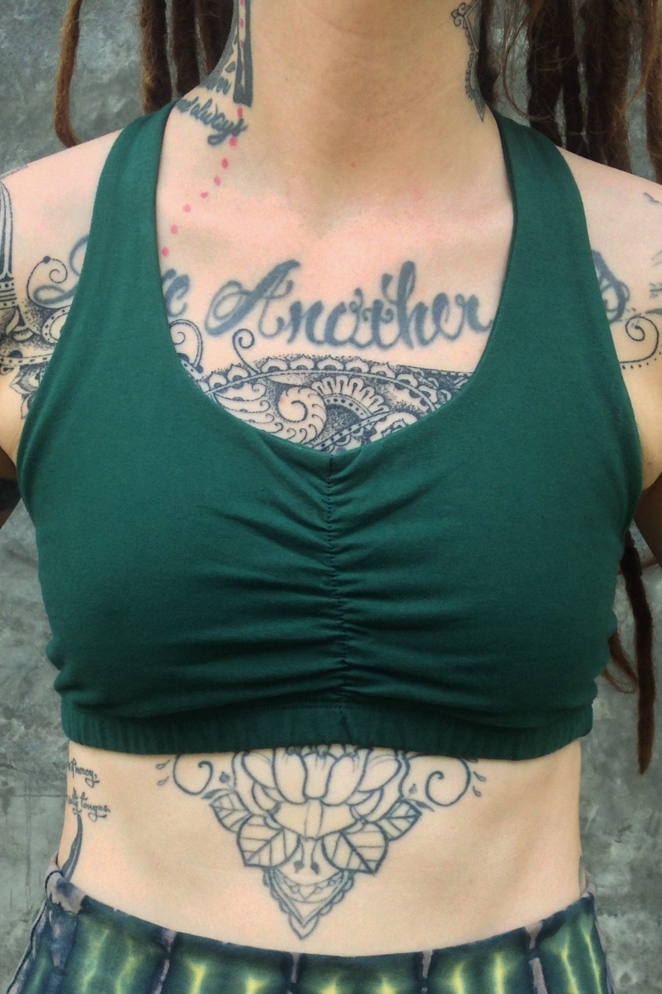 Front view of Forest green Shakti Sportsbra with scrunching between the breasts.