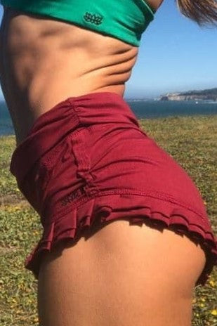 Side view of Garnet Ruffle Shorts.