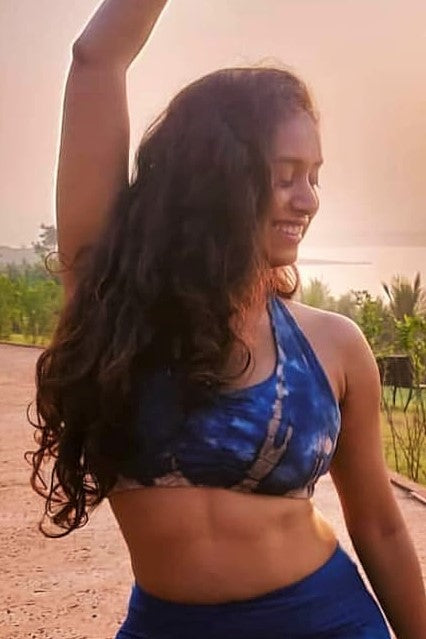 Indigo Earth tie dye Shakti Sportsbra is blue with brownish streaks and white highlights. Has scrunching between the breasts and wide straps for full coverage and support.