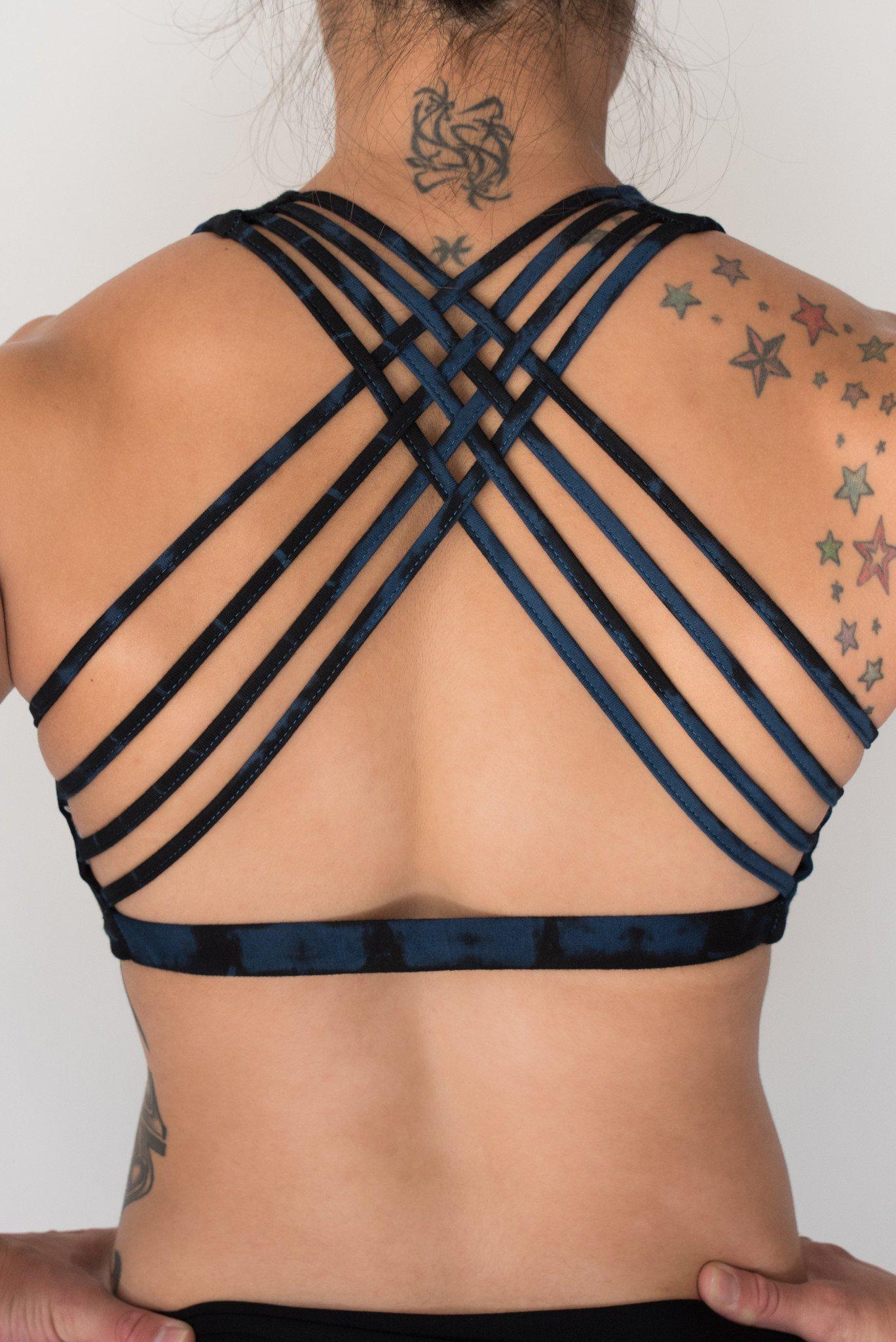 Back view showing 4 criss cross straps of Midnight Tie Dye sportsbra. Deep blue with black highlights, has full support.