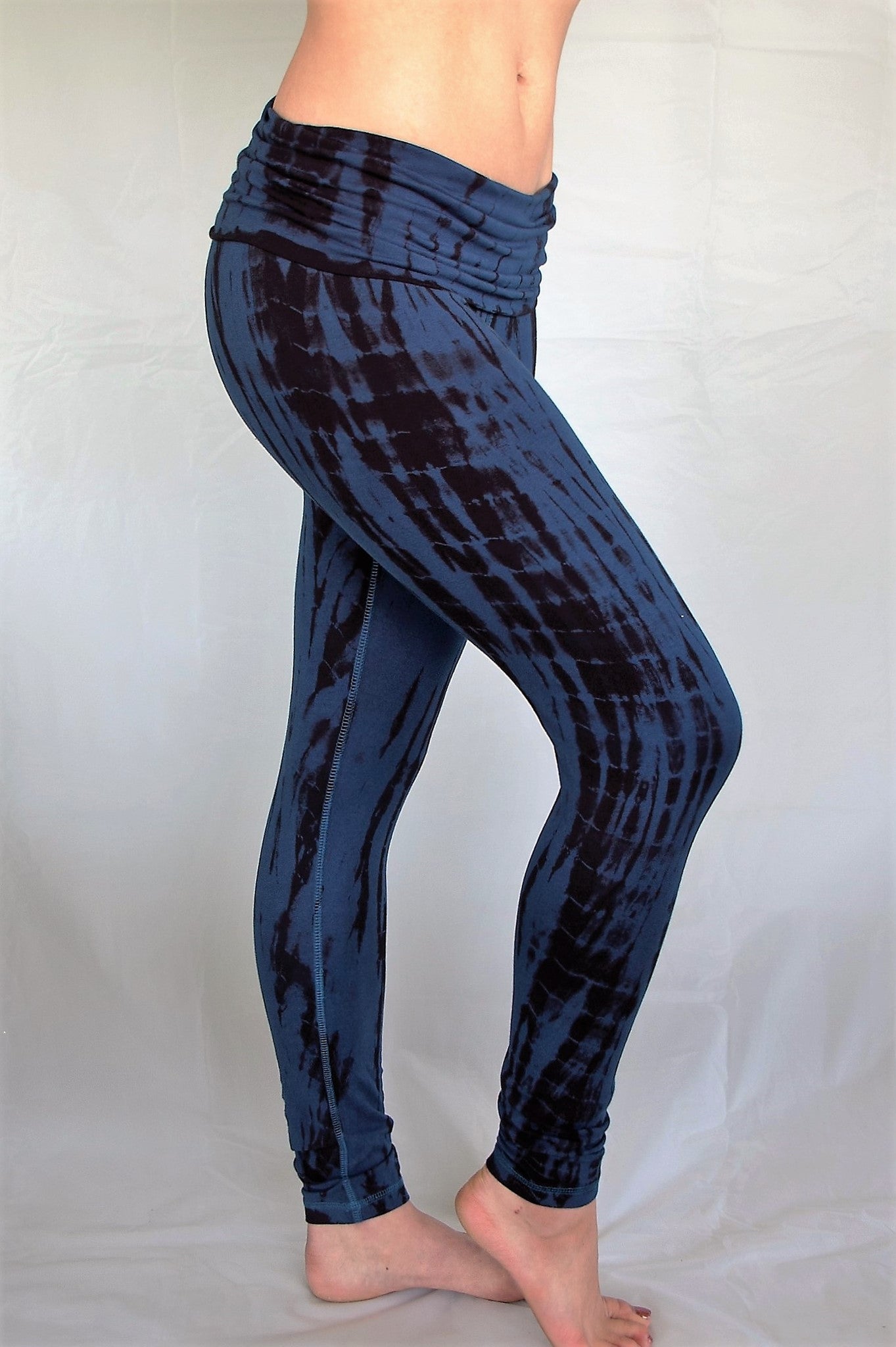 Midnight tie dye, blue with black long length yoga pants with fold over top for adjustable fit can be worn with higher waist or lower on the hips. Soft, comfortable 90% cotton 10% spandex.
