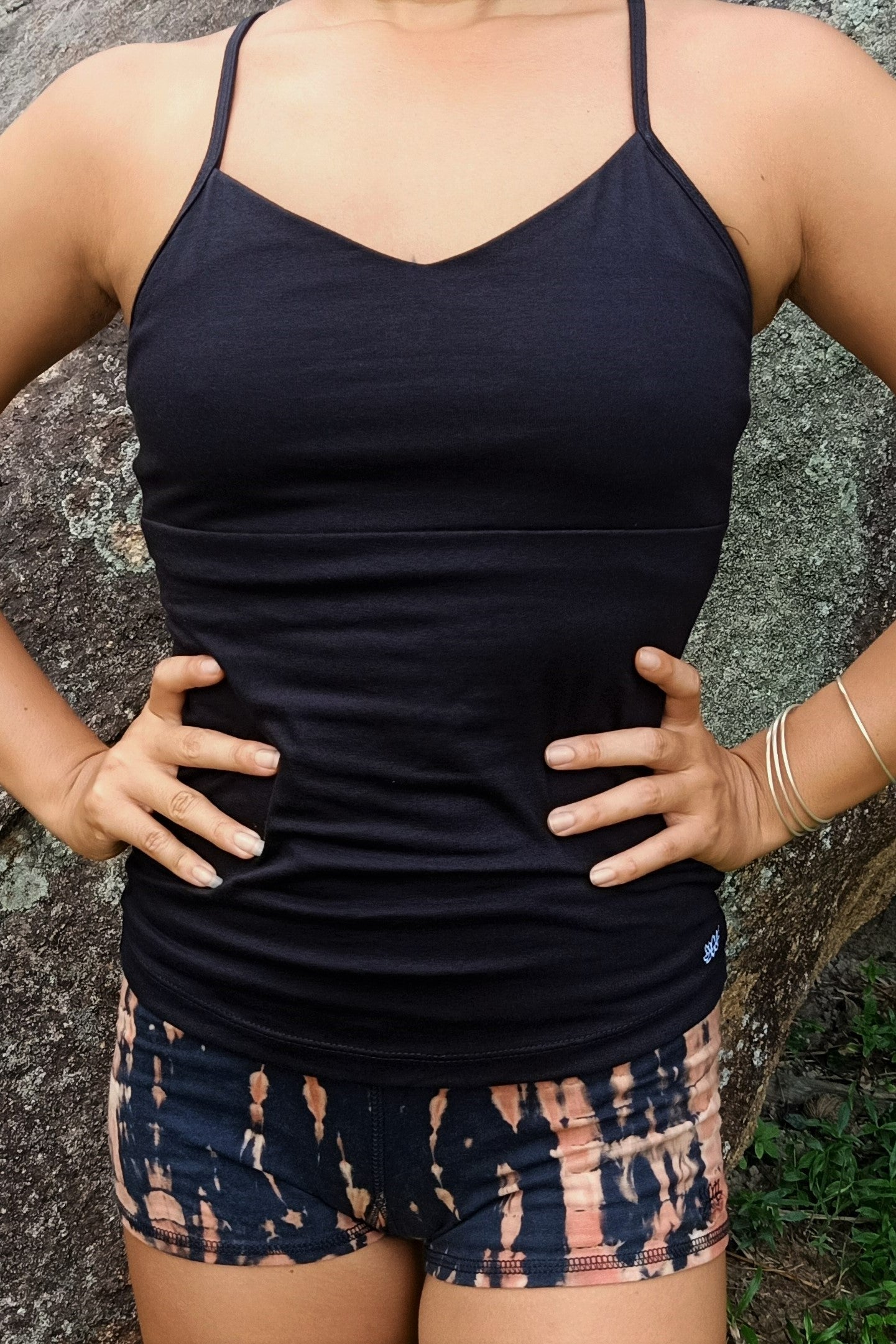 Front view of full coverage sold black Onyx Tank Top with spaghetti straps and built in bra. 90% cotton with 10% spandex.