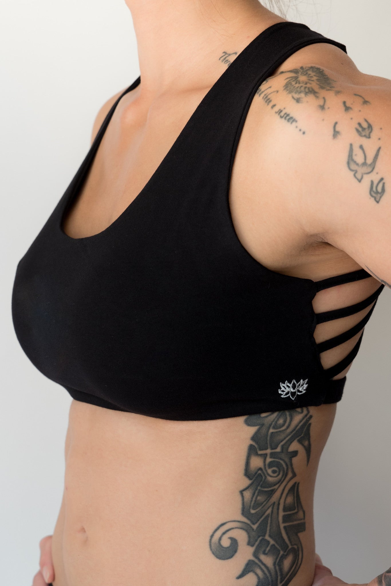 Soft, comfortable and super cute black sports bra with enough support for down dog and other yoga poses with 4 criss cross straps in back 90% cotton 10% spandex