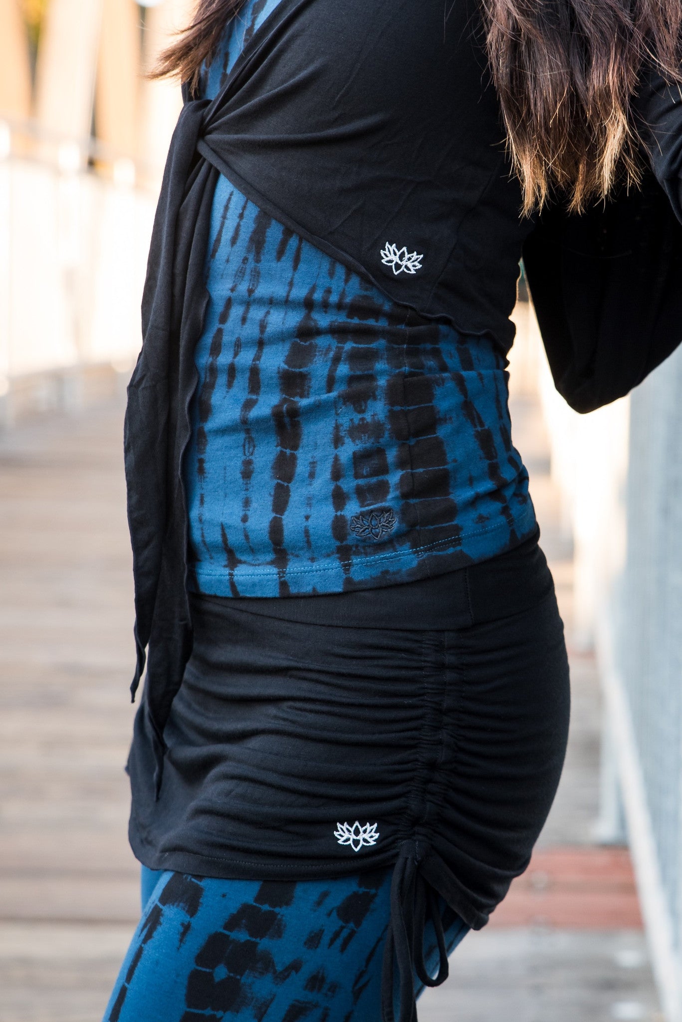 Cute little black mini skirt with pull strings on the sides and fold over waist for adjustable fit. Soft and comfortable 90% rayon 10% cotton. Fits small/medium