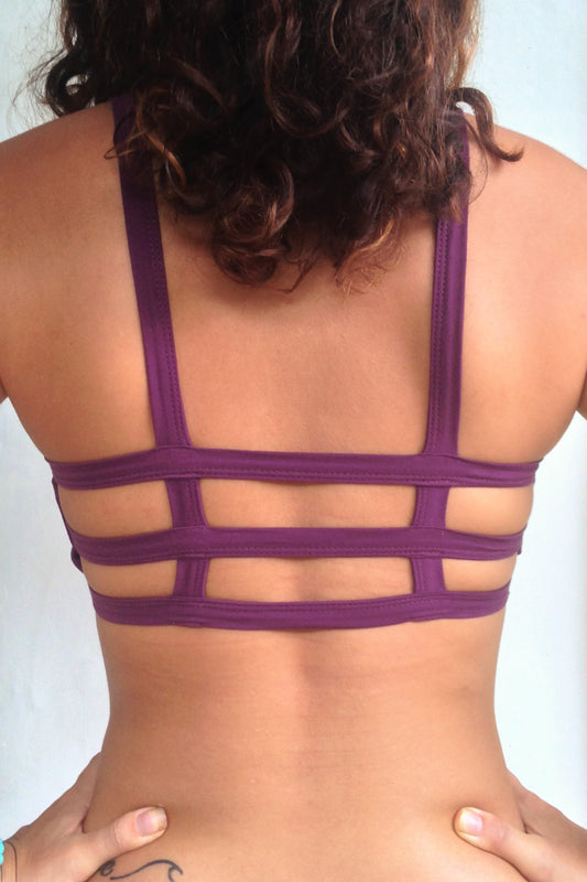 Back view of Plum Trinity Sportsbra showing 3 horizontal straps across back  One of the most comfortable sports bras you will ever wear, soft and super cute. Solid purple front 90% cotton 10% spandex
