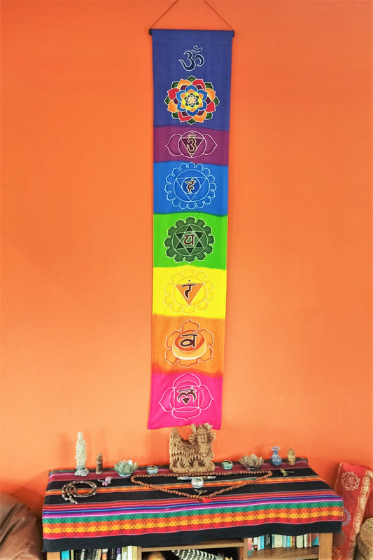 Batik Chakra Banner shows all 7 chakras from top to bottom on the vertical rayon cloth in full color. Made with wax and dye batik process on 100% rayon fabric. Ready to hand.