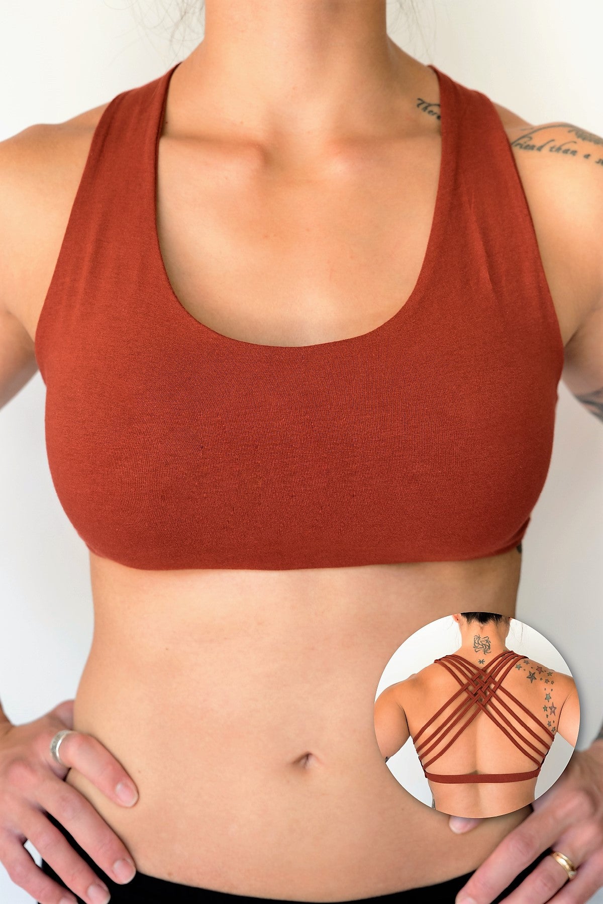 Rust sports bra with 4 criss cross straps on back with enough support for down dog and other yoga poses, or whatever sports you enjoy. 90% cotton 10% spandex