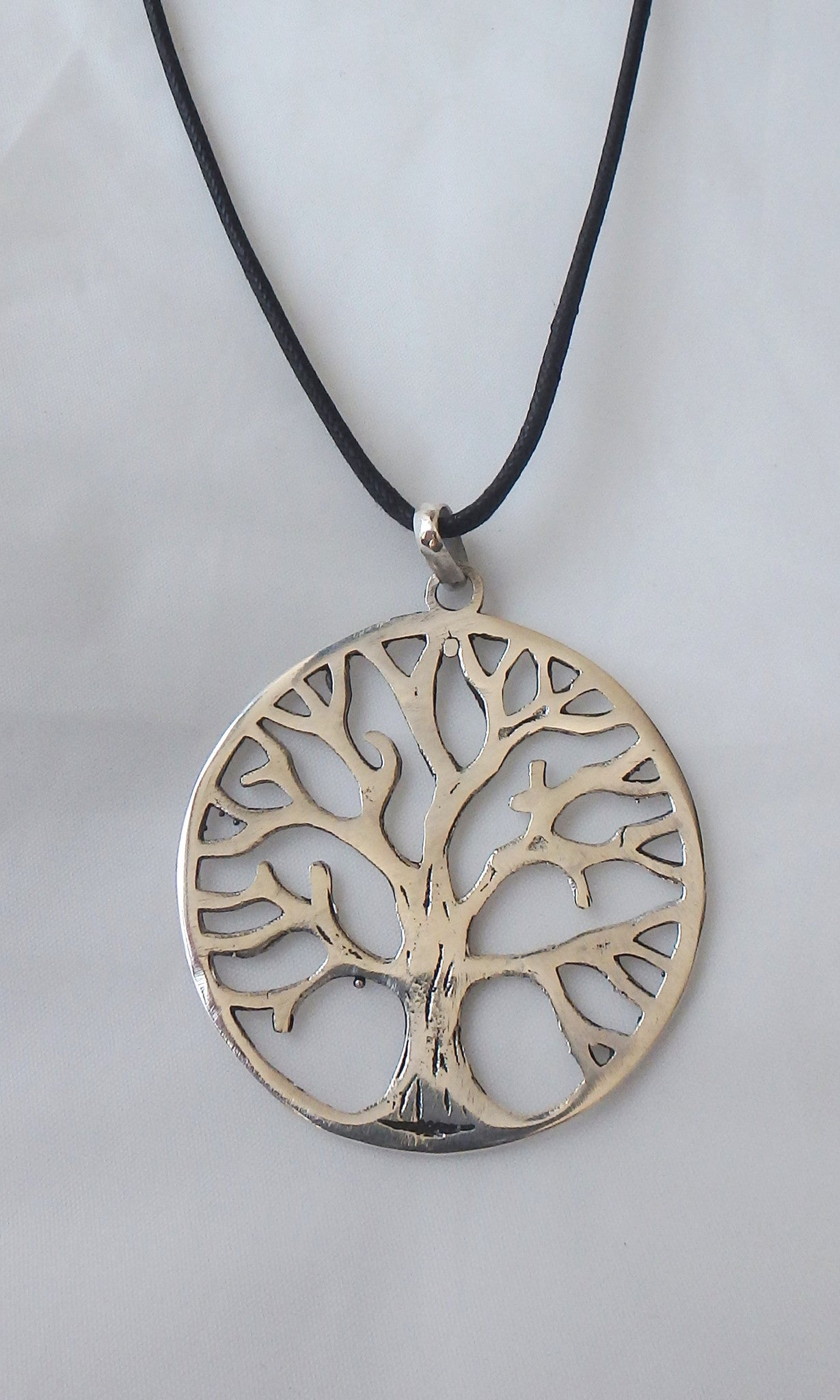 Silver Tree of Life pendant 1.75" diameter (just over 4cm) comes on black waxed cotton cord (vegan friendly).