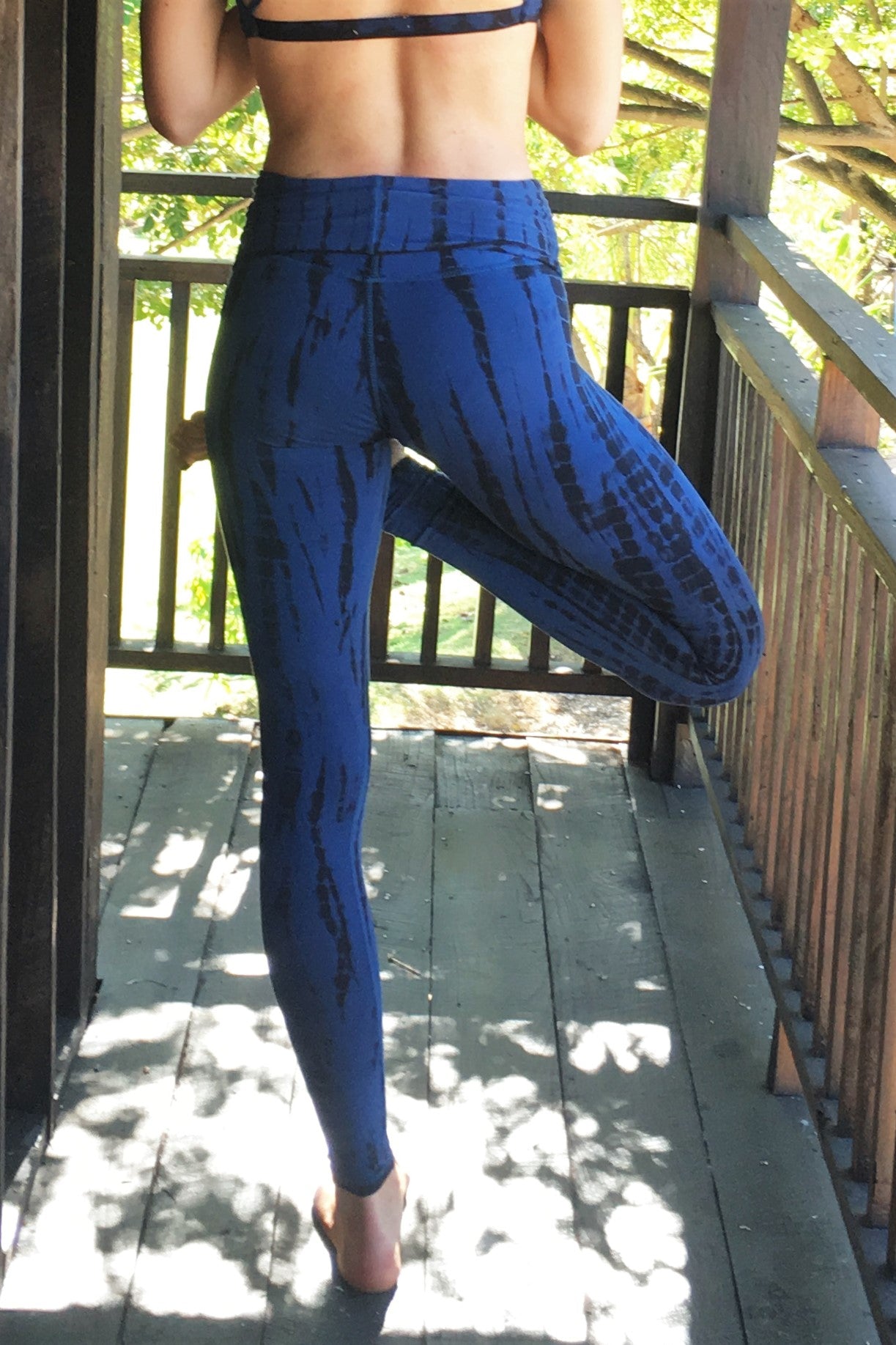 Midnight tie dye, blue with black long length yoga pants with fold over top for adjustable fit can be worn with higher waist or lower on the hips. Soft, comfortable 90% cotton 10% spandex.