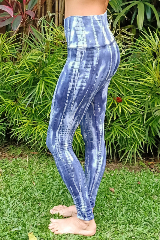 High waisted tie dye yoga pants that can also be a fold top waist. Blue-ish purple with grey streaks and white highlights. 