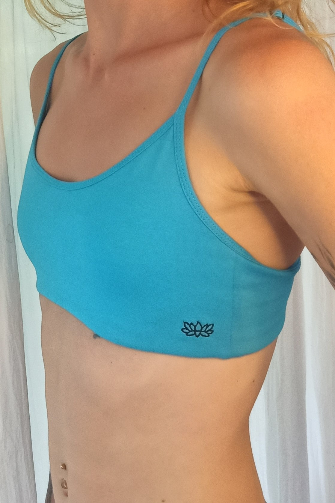 Side view of woman wearing Zen Sports Bra show full coverage on front and sides. 