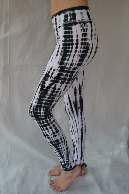 Long yoga pants in crisp black and white tie dye. Flat top waist and extra long length. 90% cotton 10% spandex.