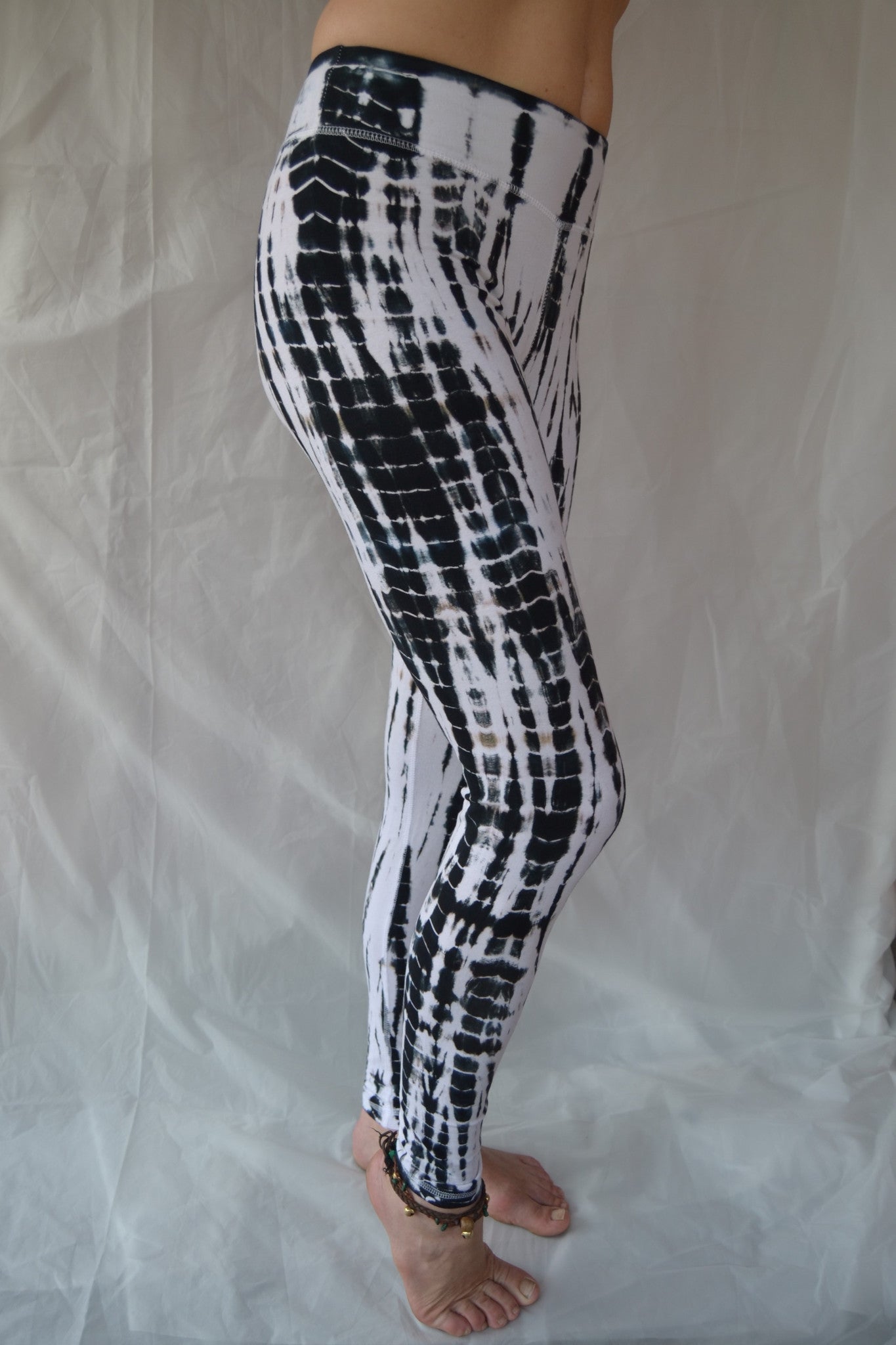 Long yoga pants in crisp black and white tie dye. Flat top waist and extra long length. 90% cotton 10% spandex.