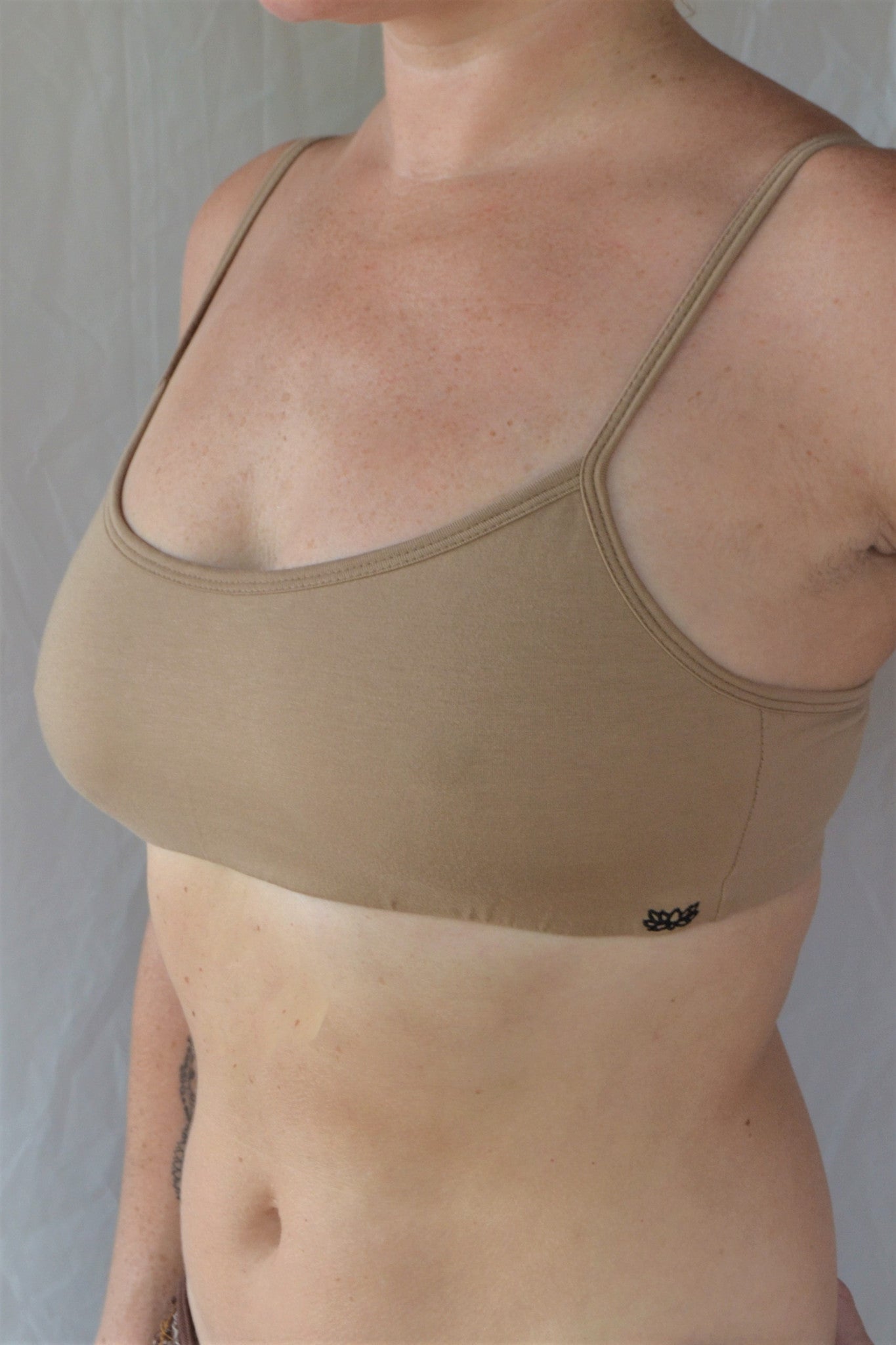 Enjoy a perfect state of zen in our basic, minimalist sportsbra. Solid beige. Medium support, great for an active lifestyle with adjustable spaghetti straps.