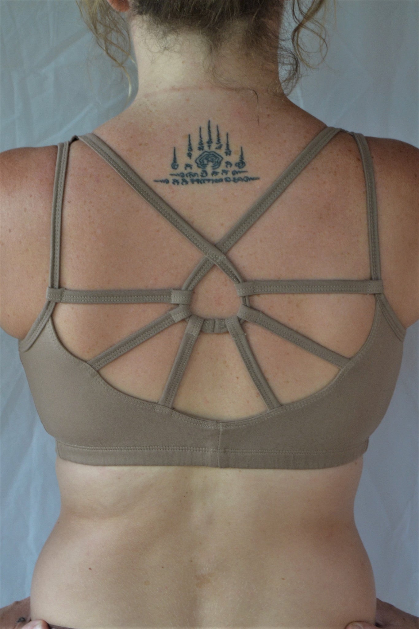 Sand (beige) SportsBra with sunburst design straps on back. Fits large chested active women especially while still being soft, cute, comfortable and functional.