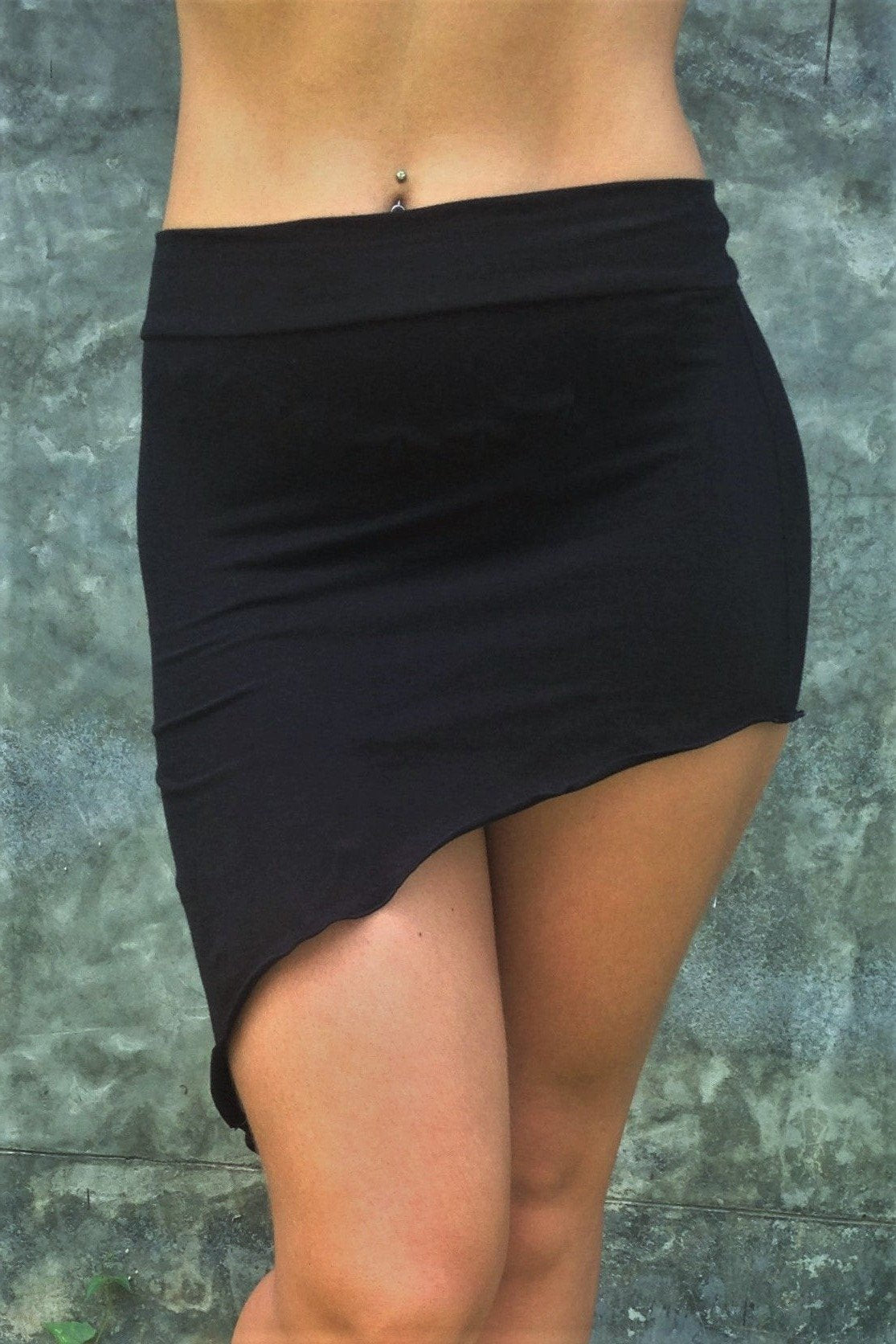 Festival Skirt by Lotus Tribe Clothing is a stretchy asymmetrical, easy to wear comfortable mini skirt. Looks great over bare legs or can be layered with leggings in cool er weather. Fold the top over or wear high waisted, custom form fits to your body shape. Soft and stretchy 90% cotton knit with 10% spandex. 