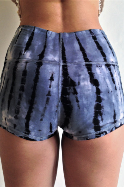 Soft and comfortable steel blue with black tie dyed yoga shorts with fold over waist for adjustable custom fit, can be worn higher waisted, or low on the hips.