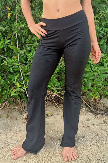 Front view of Flared bottom Yoga Pants in solid black Onyx with flat waist band by Lotus Tribe Clothing