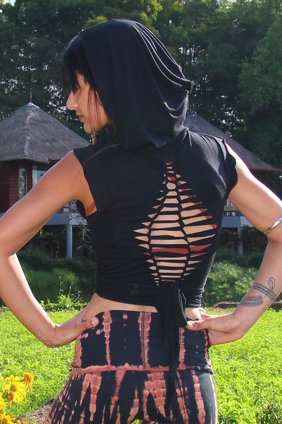 Sleeveless Onyx Ninja Jacket Wraps come with oversized hood and see thru detail on back. Soft and silky, perfect for layering over a sportbra after yoga class or as streetwear 