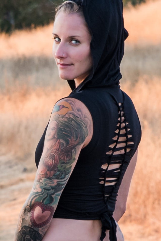 Sleeveless Onyx Ninja Jacket Wraps come with oversized hood and see thru detail on back. Soft and silky, perfect for layering over a sportbra after yoga class or as streetwear 