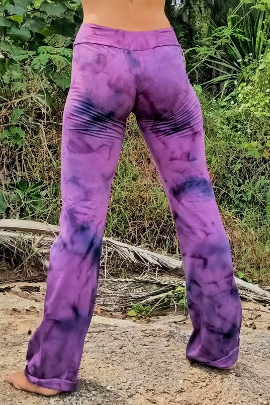 Back view of purple krinkle tie dye flared booty hugging yoga pants with flat top waist band. 