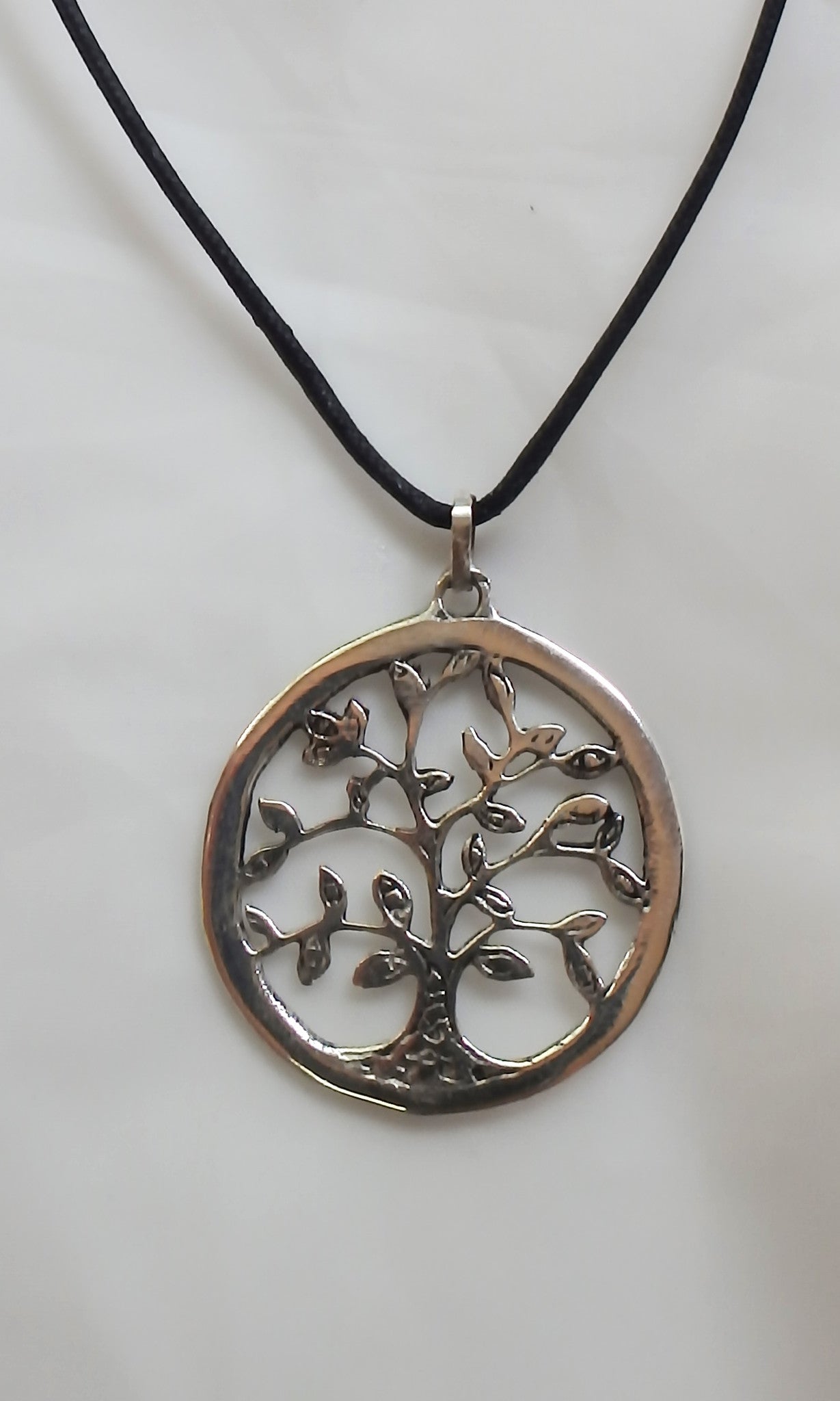 Silver Tree of Life pendant 1.5" diameter (3.5 cm) comes on black waxed cotton cord (vegan friendly). 