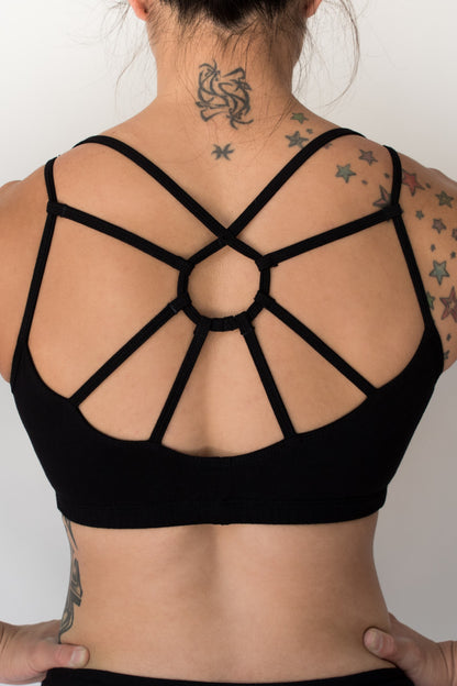 Onyx sports bra with heavy duty full coverage front for large breasted and fuller figured women. Has sunburst design in straps on back. Cute, comfortable and functional!