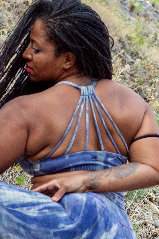 Back view of Shakti Sports Bra shows beautiful back straps pattern on cool purple/blue tie dye. 