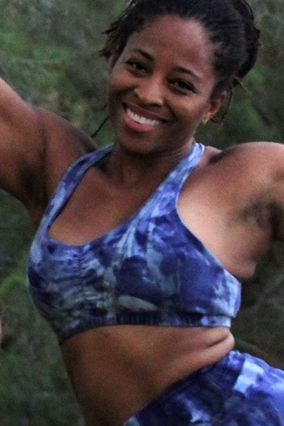 Wildflower tie dye Shakti Sports Bra with wide straps and puckered scrunching between the breasts.