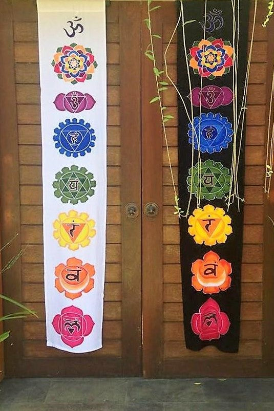 Batik wall art with rainbow chakra symbols. Ethically made by hand batik artwork. 