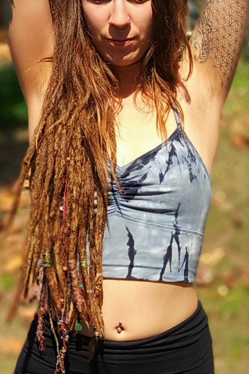 Sodalite tie dye is a steel blue with black streaks and white highlights on this Blissed Out Crop tank with spaghetti straps and scrunching between the breasts. 